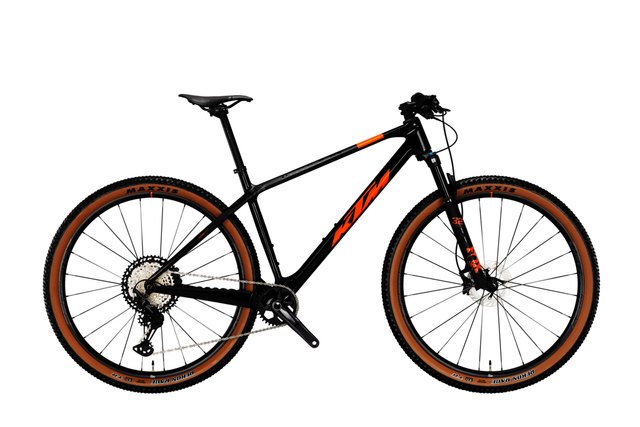 KTM MYROON MASTER carbon hardtail mountain bicycle in black and orange, side view