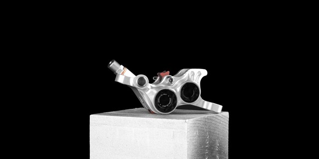 Hope Technology Hope RX4+ SL Post Mount DOT 4-Piston Caliper. Manufacturer reference photo; color and size may vary.